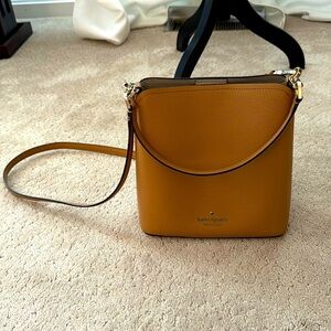 NWOT tags Kare Spade Darcy Bucket Bag in classic saddle. No marks or scratches.